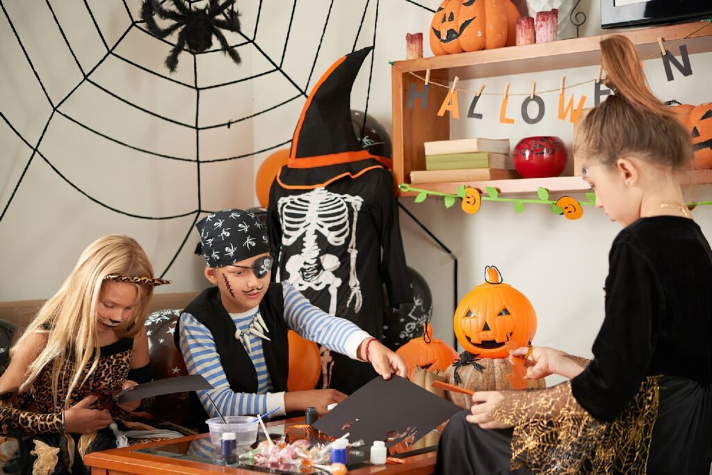 Kids crafting Halloween accessories, halloween decorations