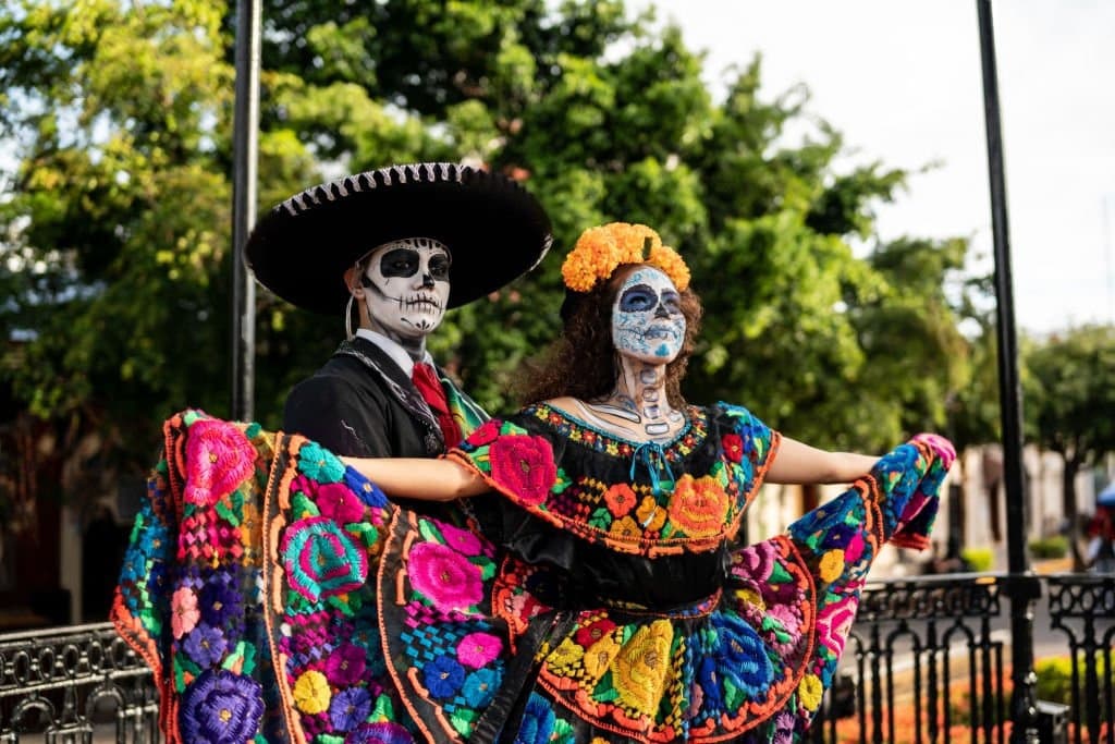 Young couple celebrating El Dia de los Muertos