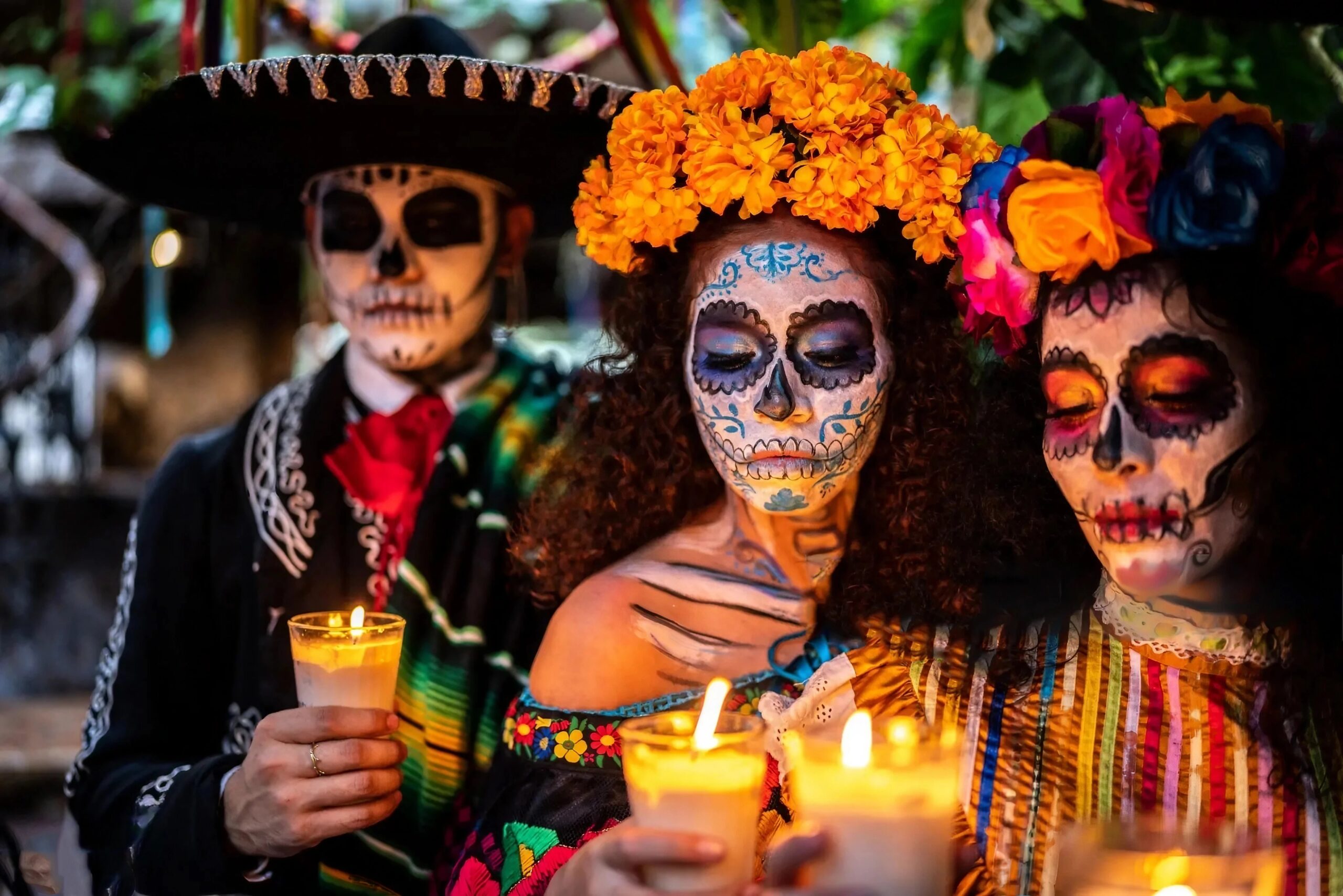 3 people celebrating el dia de los muertos